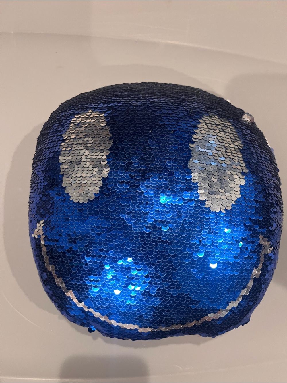 Blue Sequin Smile Pillow with Silver Accent
